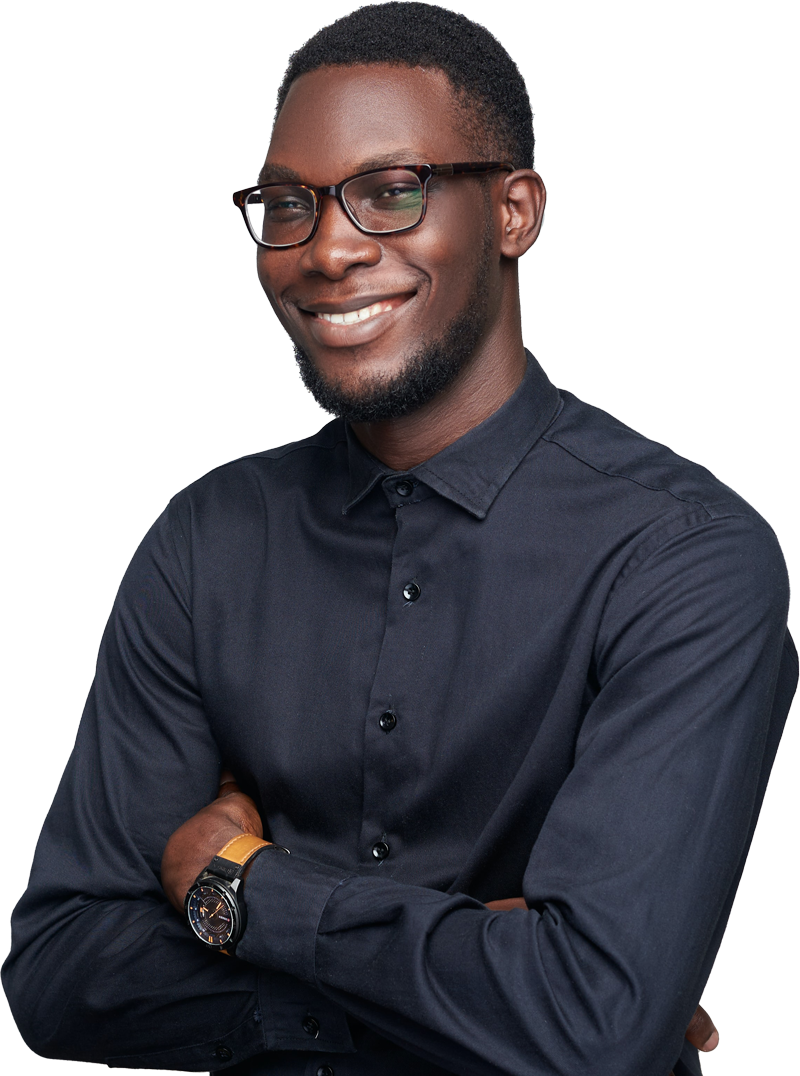 A person smiling at the camera with their arms folded